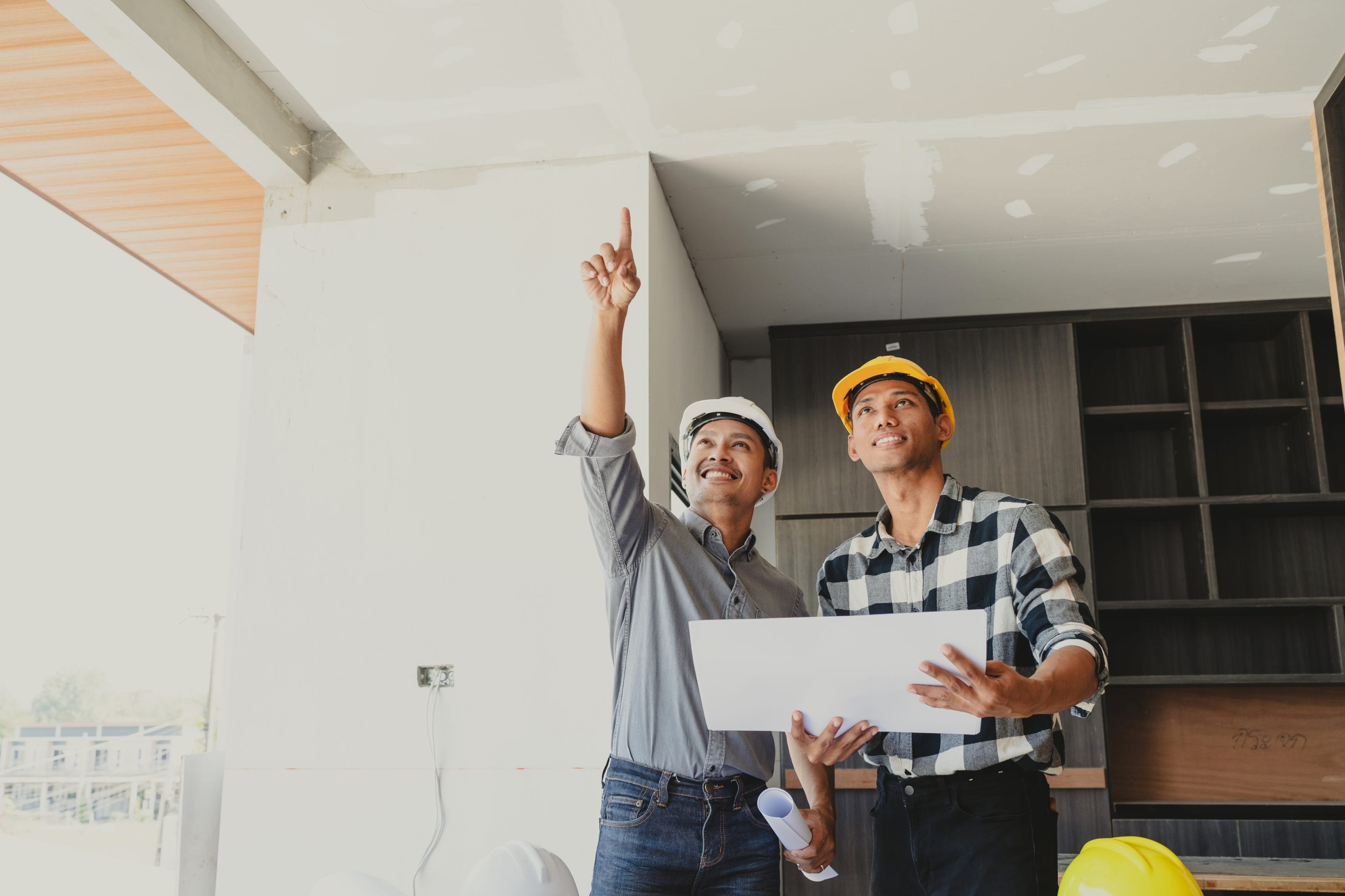 Pre-Listing Home Inspection Showing Inspector with Clipboard in Kitchen
