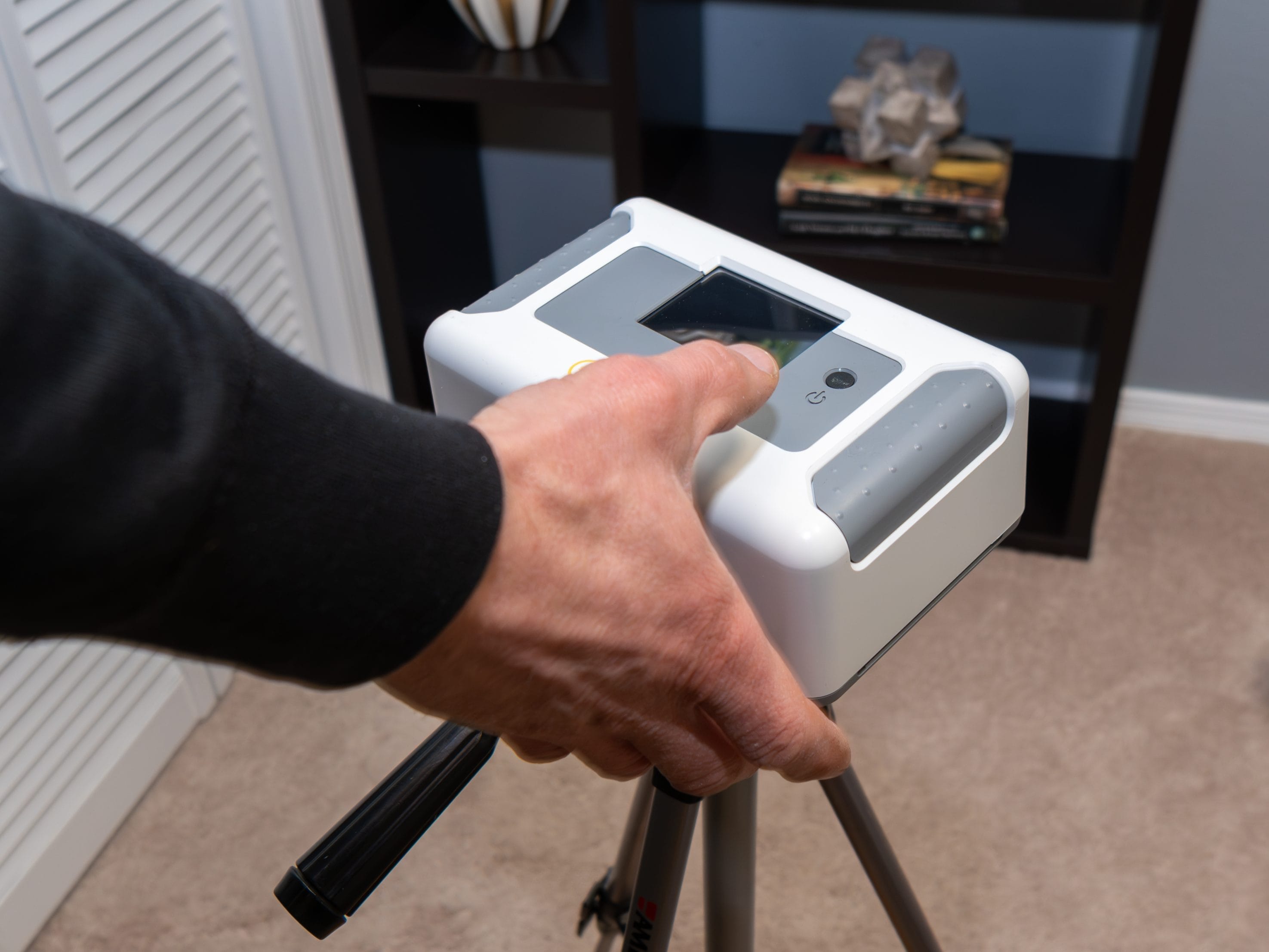 Home radon testing kit on a wooden surface
